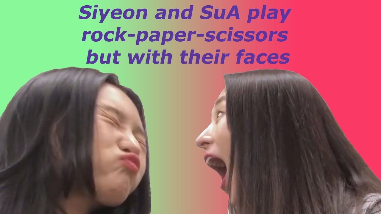 Siyeon and SuA play rock-paper-scissors but with their faces