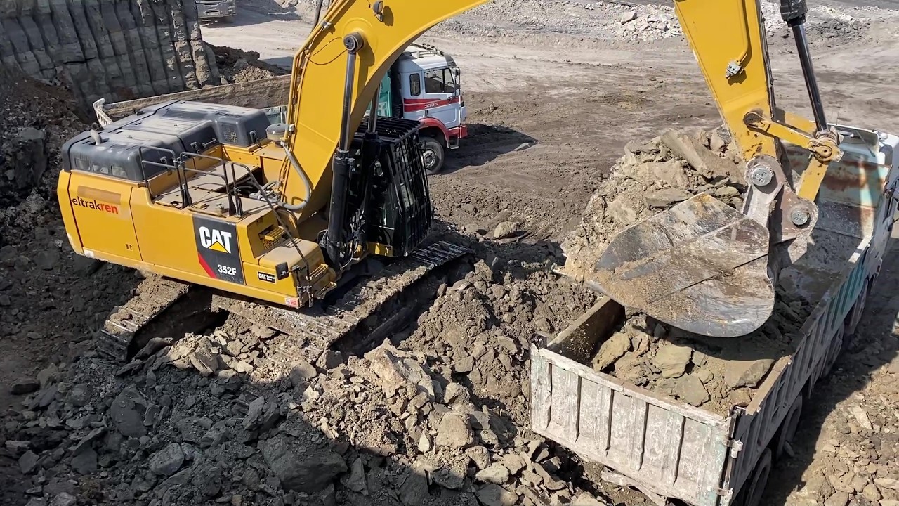 Caterpillar 352F Excavator Loading Overburden On Mercedes & MAN 4 Axle Trucks - Ascon Ltd