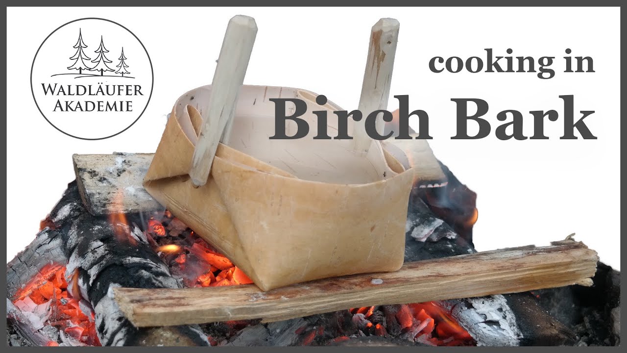 Cooking in birch bark container on open fire in snow