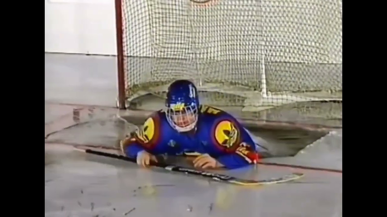 HOCKEY GOALIE FALLS THROUGH ICE