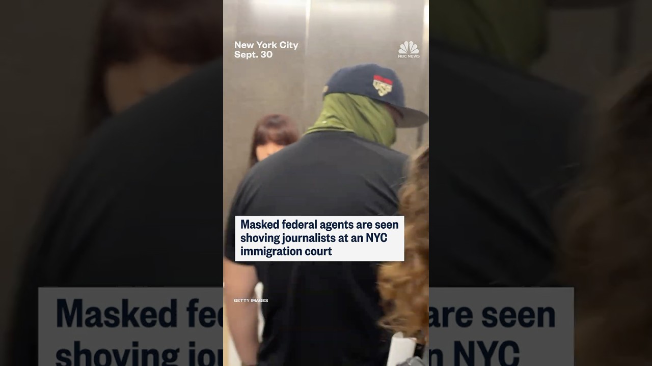 Masked federal agents are seen shoving journalist at an NYC immigration court
