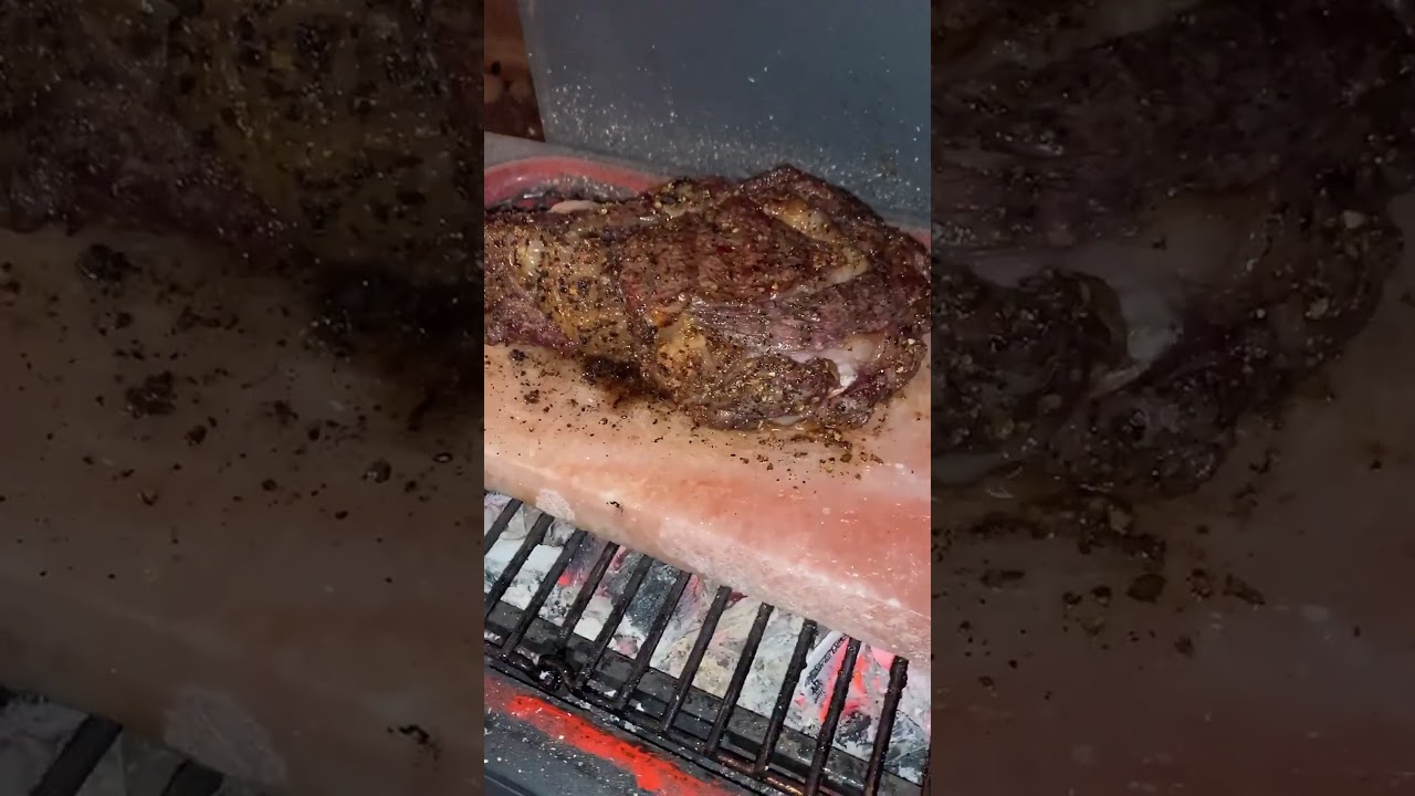 Cooking tomahawks on pink himalayan salt block