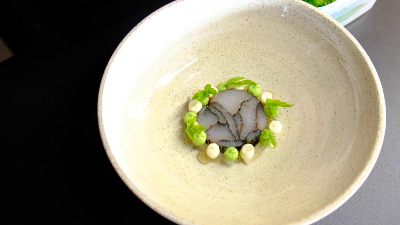 Thijs Meliefste prepares a pike perch dish at his restaurant