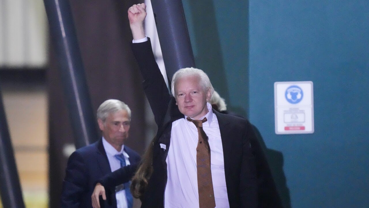 WikiLeaks founder Julian Assange touches down in Canberra