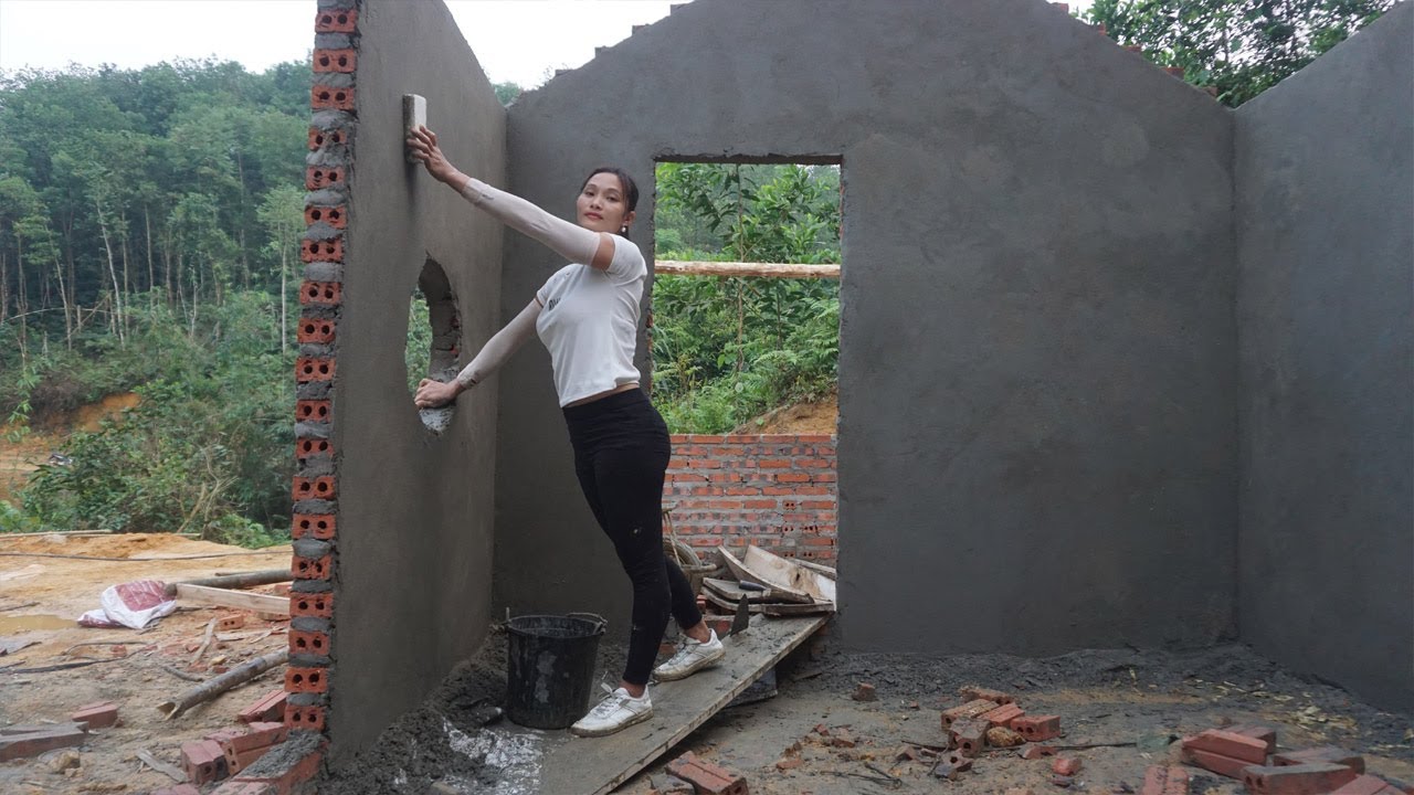 Lonely 20 year old girl: Building bricks house - Apply the cement coat to the wall - Build new house