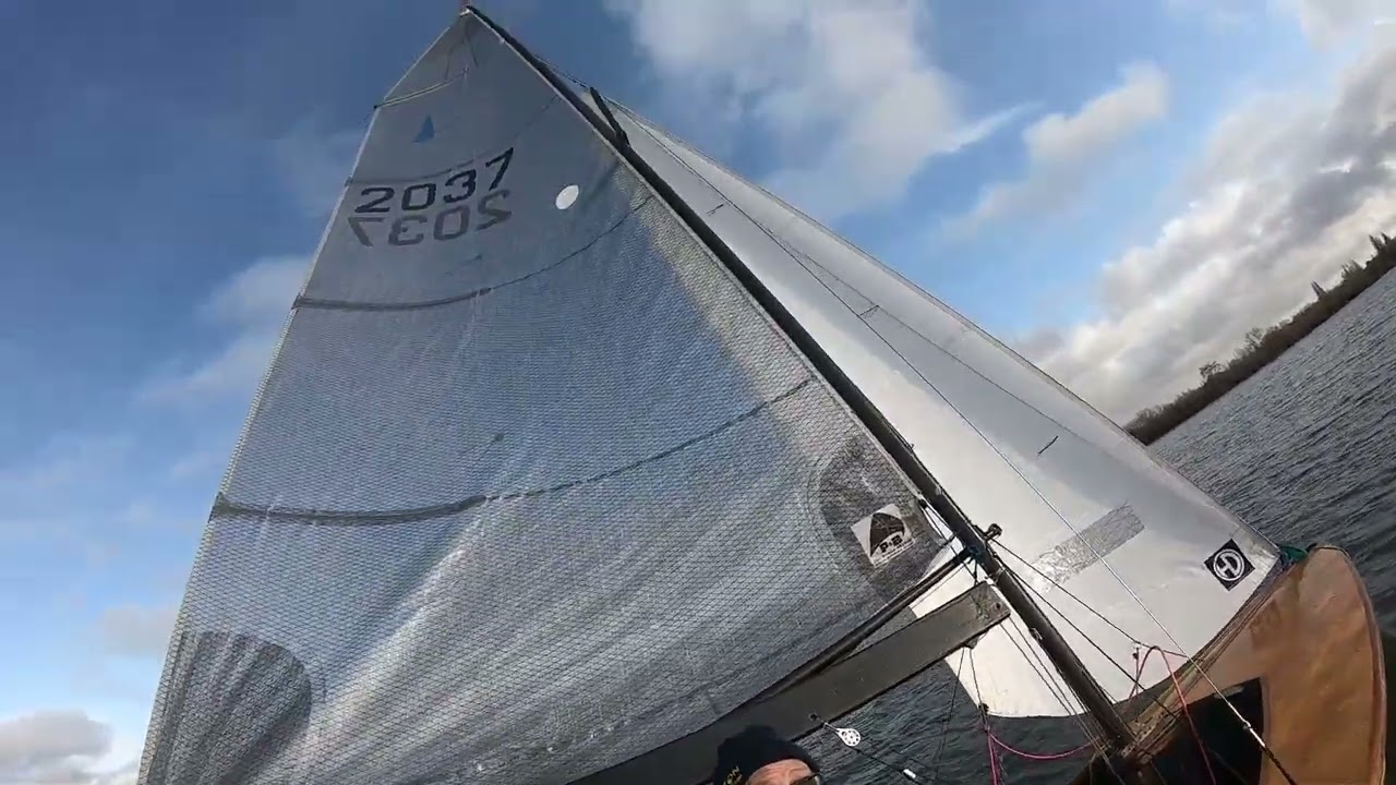 Two men in a (Merlin) boat, and another in a British Moth