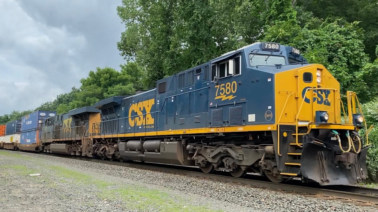 A fresh CSX  CM44AH #7580 leads a short I022 with a friendly crew