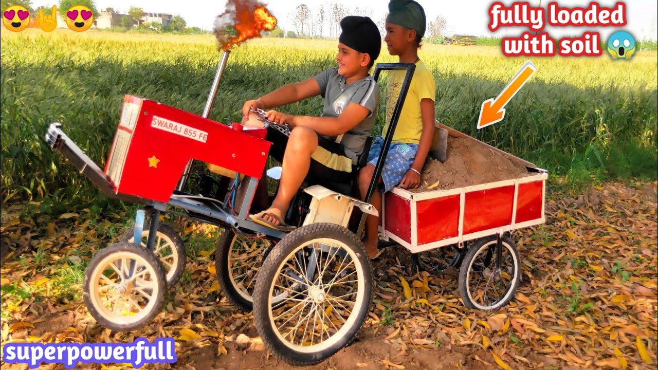 Homemade mini powerful Tractor pulling heavy loaded trolley with soil | DIY tractor|