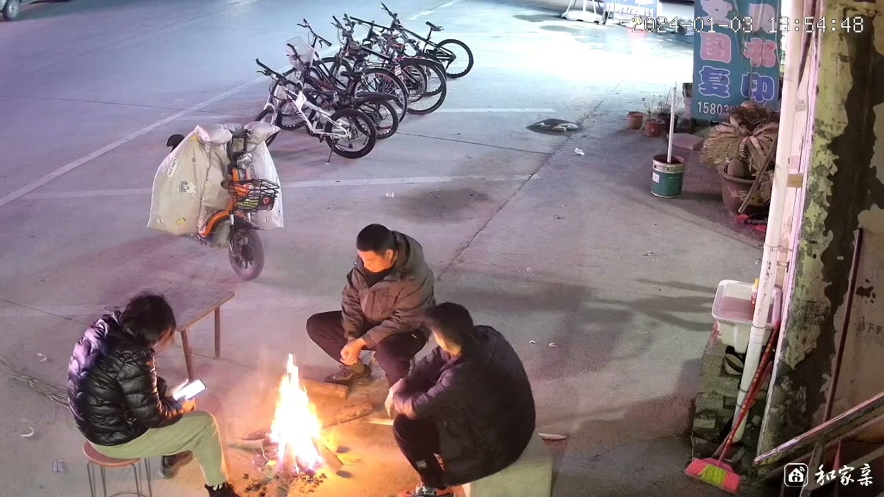 Men startled by fire spark during bonfire in Henan, China