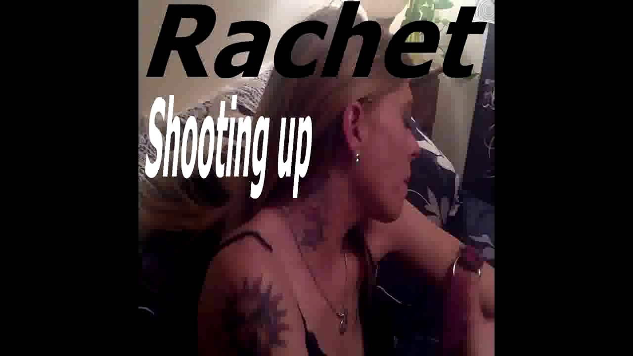 Rachet/shooting up dope in her neck and arm