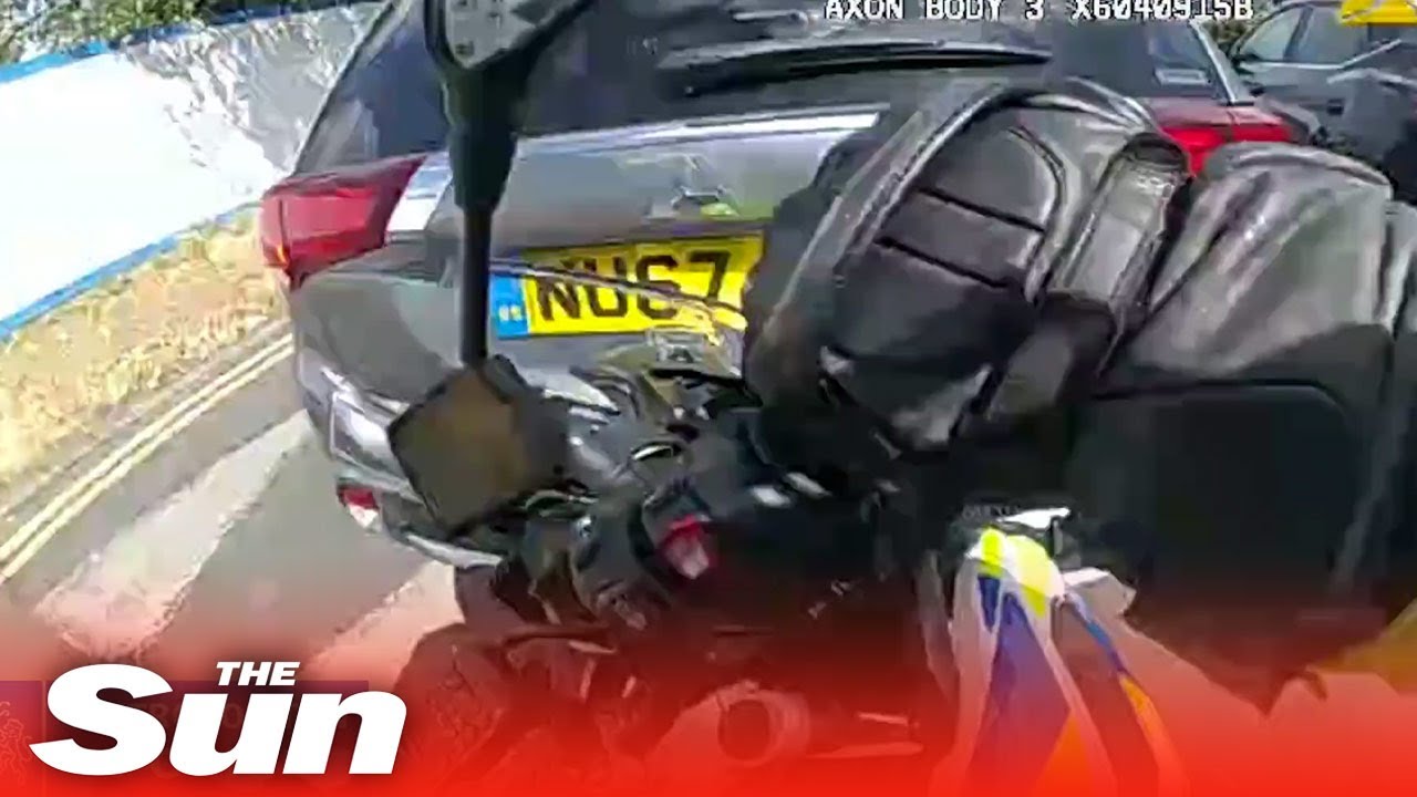 Raging driver RAMS police officer off his motorbike in horror hit and run