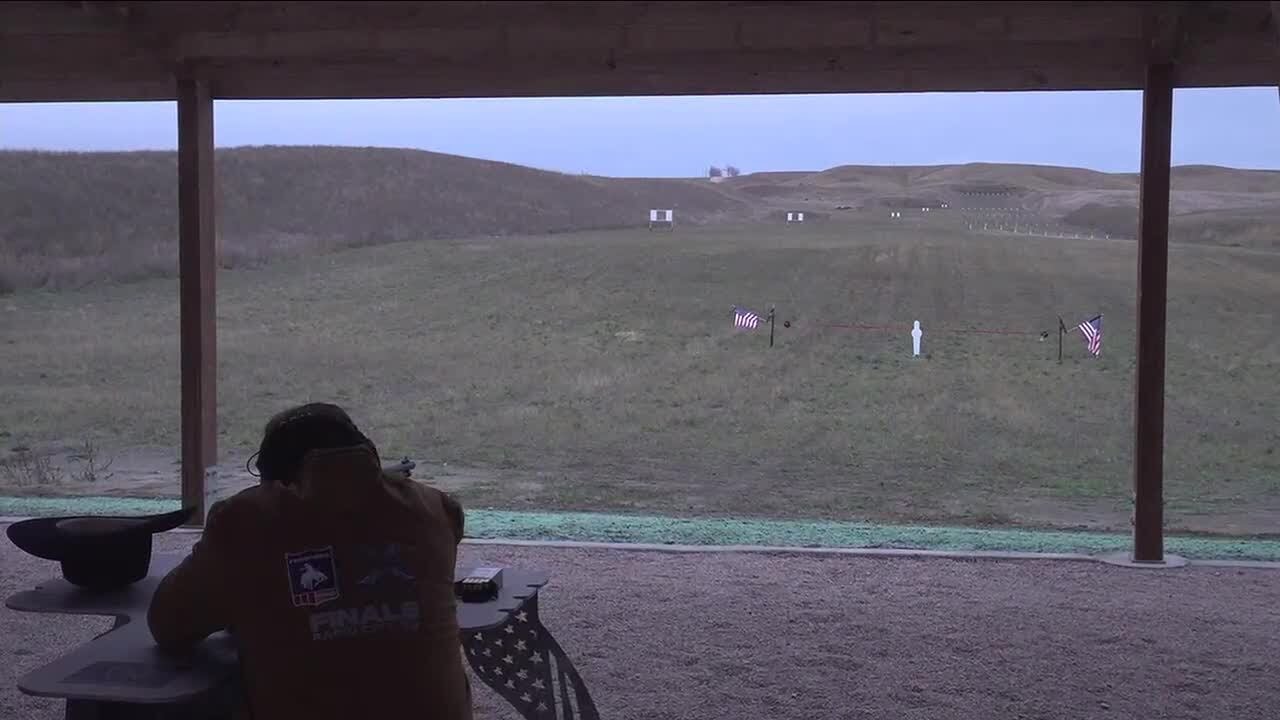 Governor Larry Rhoden shoots ribbon to open new shooting complex