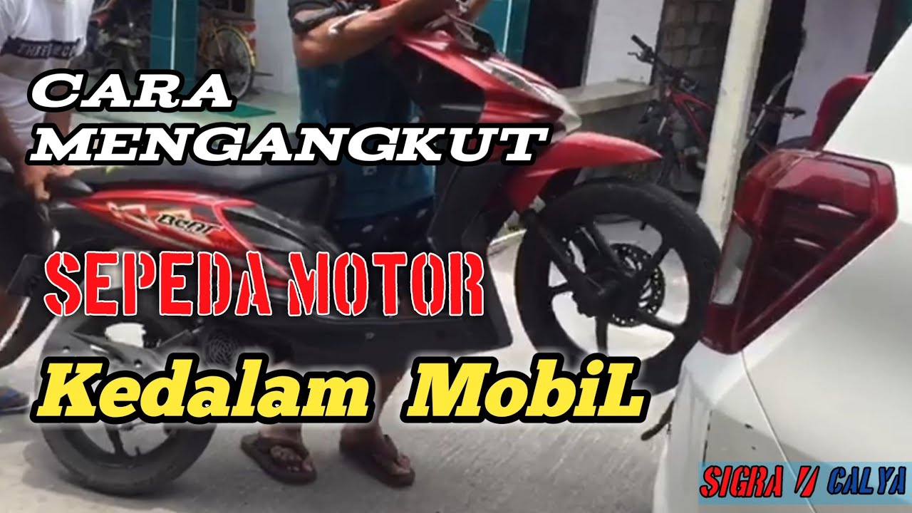 mengangkut motor kedalam mobil