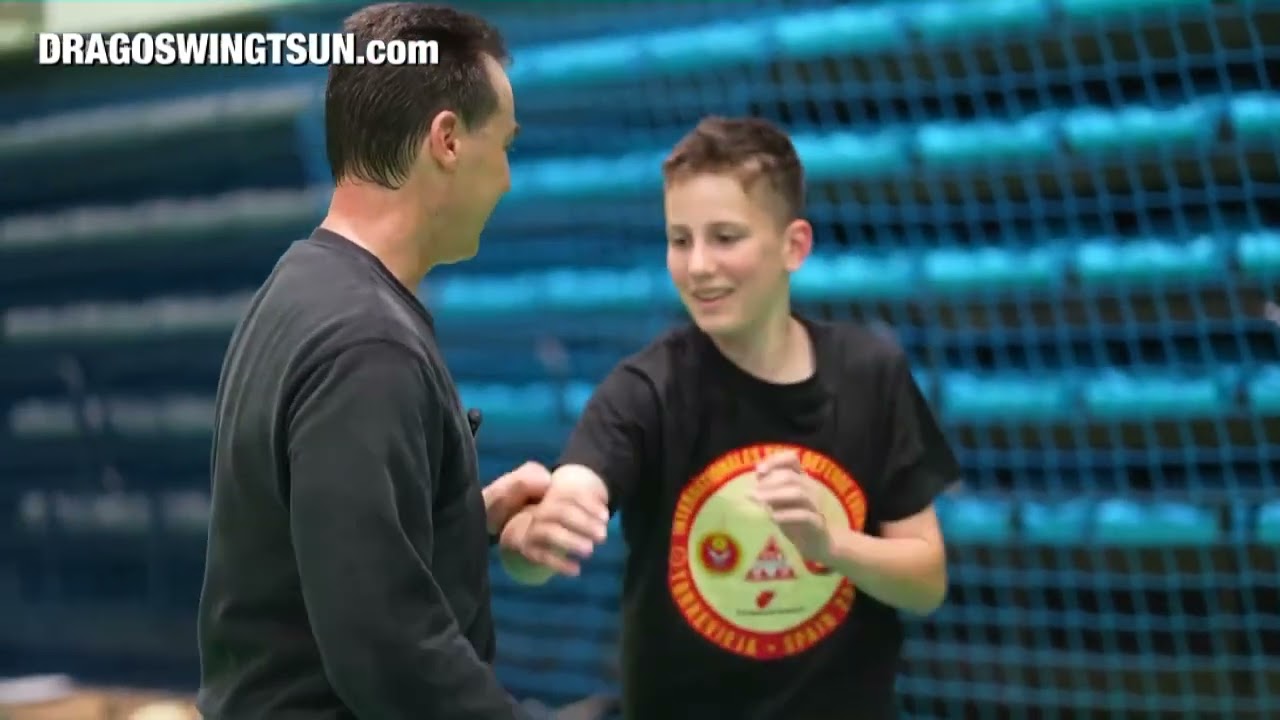 Sifu Martin Dragos giving Mini lesson to a young Student