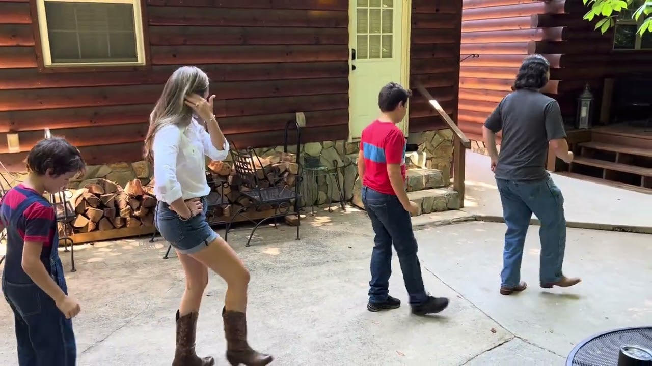 Zeb Ross from J. Creek Cloggers teaching Copperhead Road line dance at Carolina Creekside Cabin