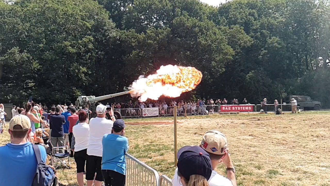Naval cannon firing in slow motion.
