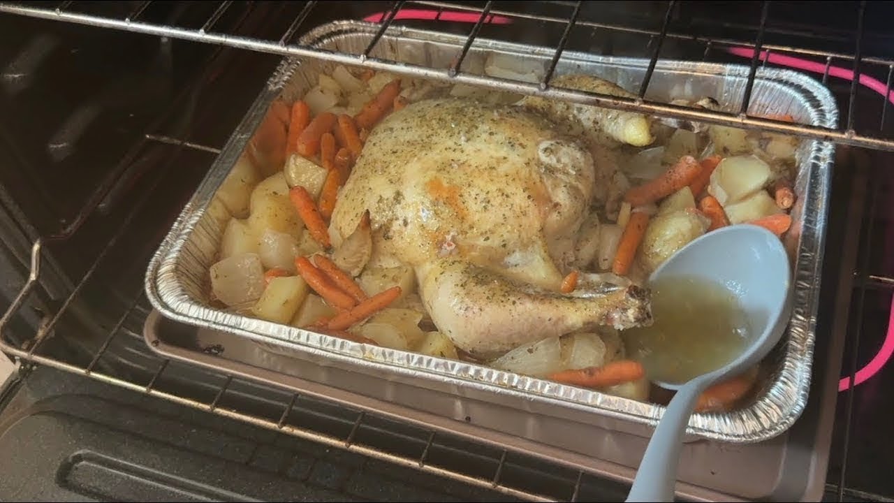 Tasty chicken with  potatoes slowly roasting in the oven for four hours. It was delicious.