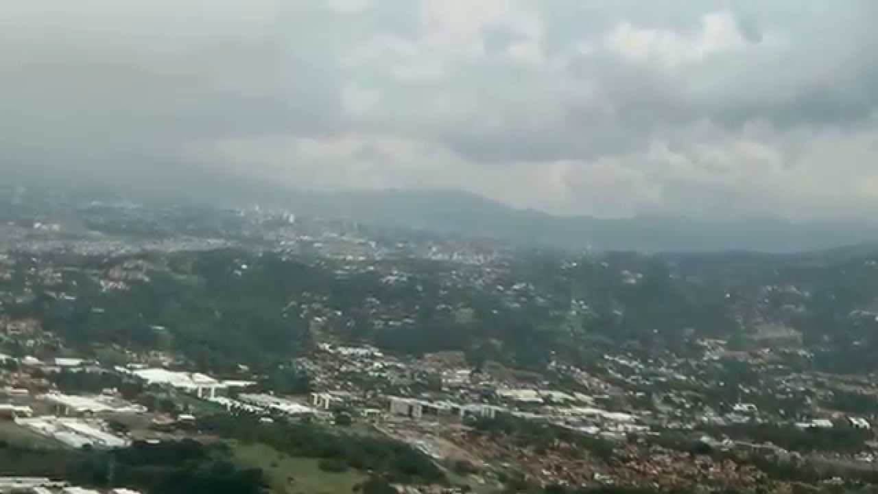 COCKPIT VIEW OF LANDING AT SAN JOSE COSTA RICA AIRPORT CIRCLING RWY 25