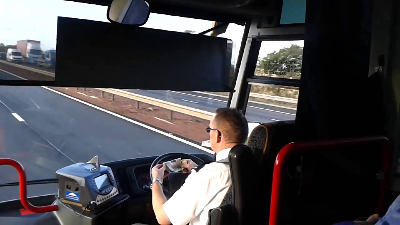 Bus driver sorts cash while driving along motorway at 60mph