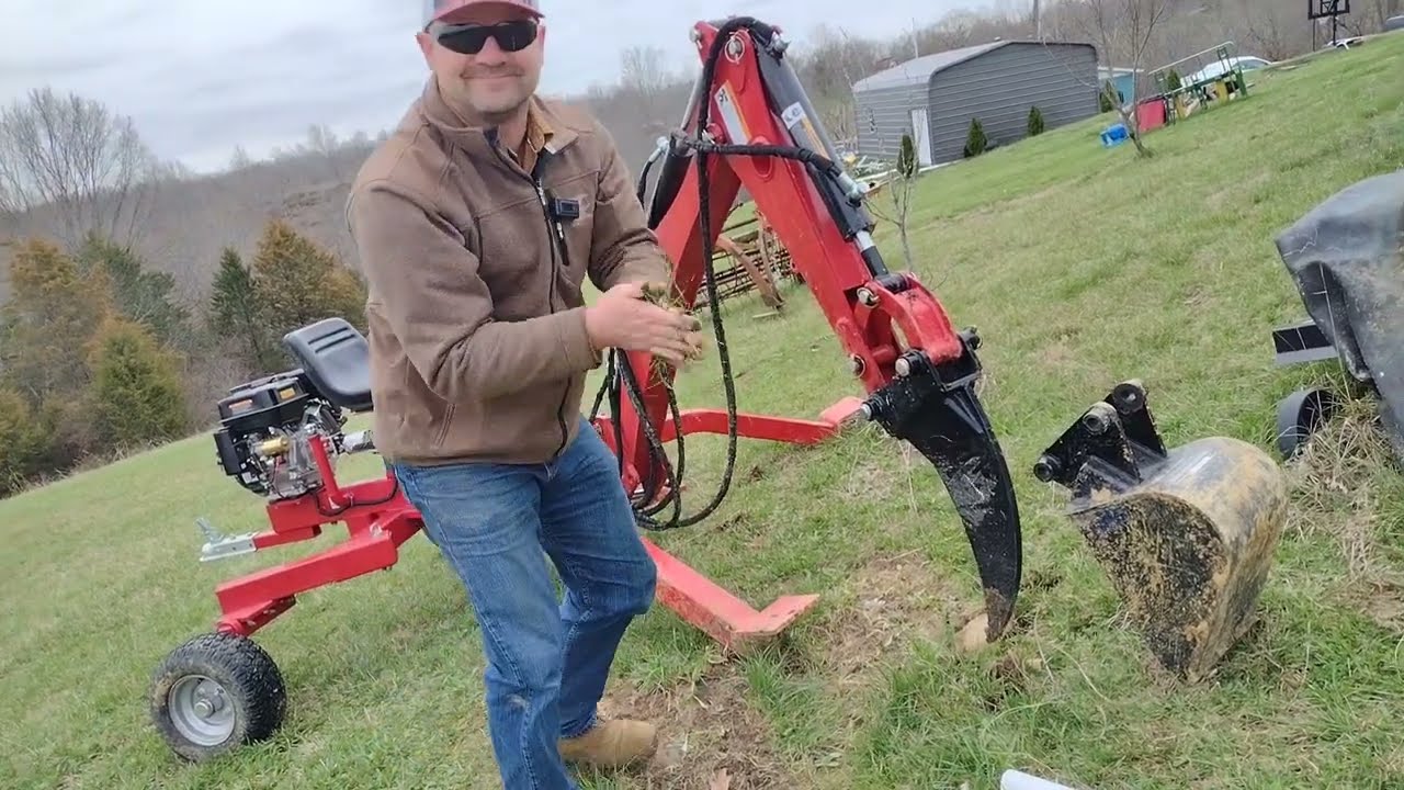 Nortrac backhoe ripper and 12