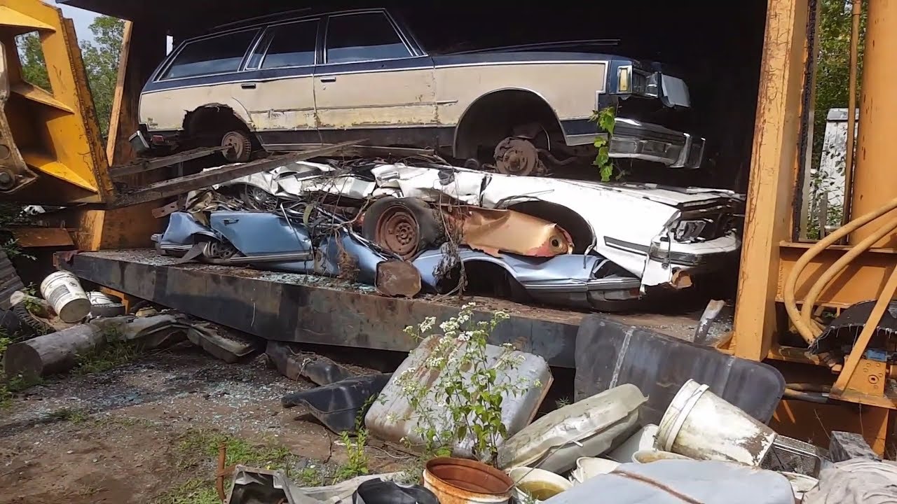 car crusher crushing cars 47 1969 Buick riviera