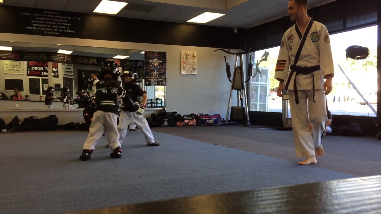 Taekwondo kids. GioTheJedi sparring with weapons. He's the shorter thicker boy.