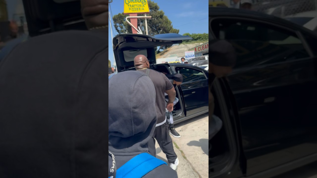 Snoop Dogg arrives at the grand opening of his new cannabis store in Los Angeles