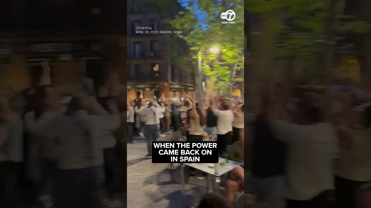 Crowds cheer as electricity restored in Spain following massive power outage