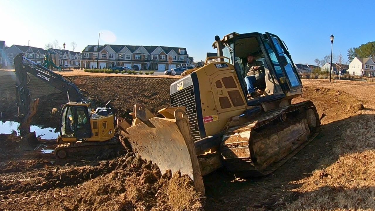 Grading a NASTY pond with a CAT BULLDOZER and DEERE EXCAVATOR!