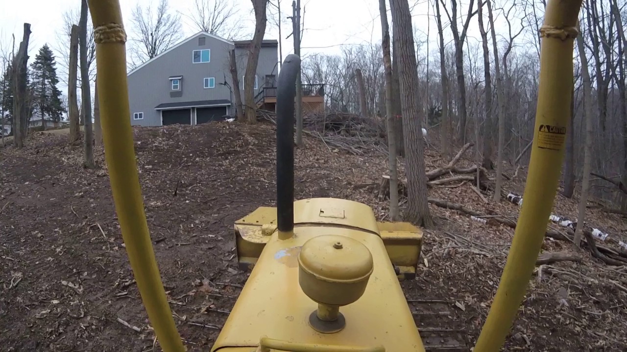skidding a log with the john deere 350 dozer