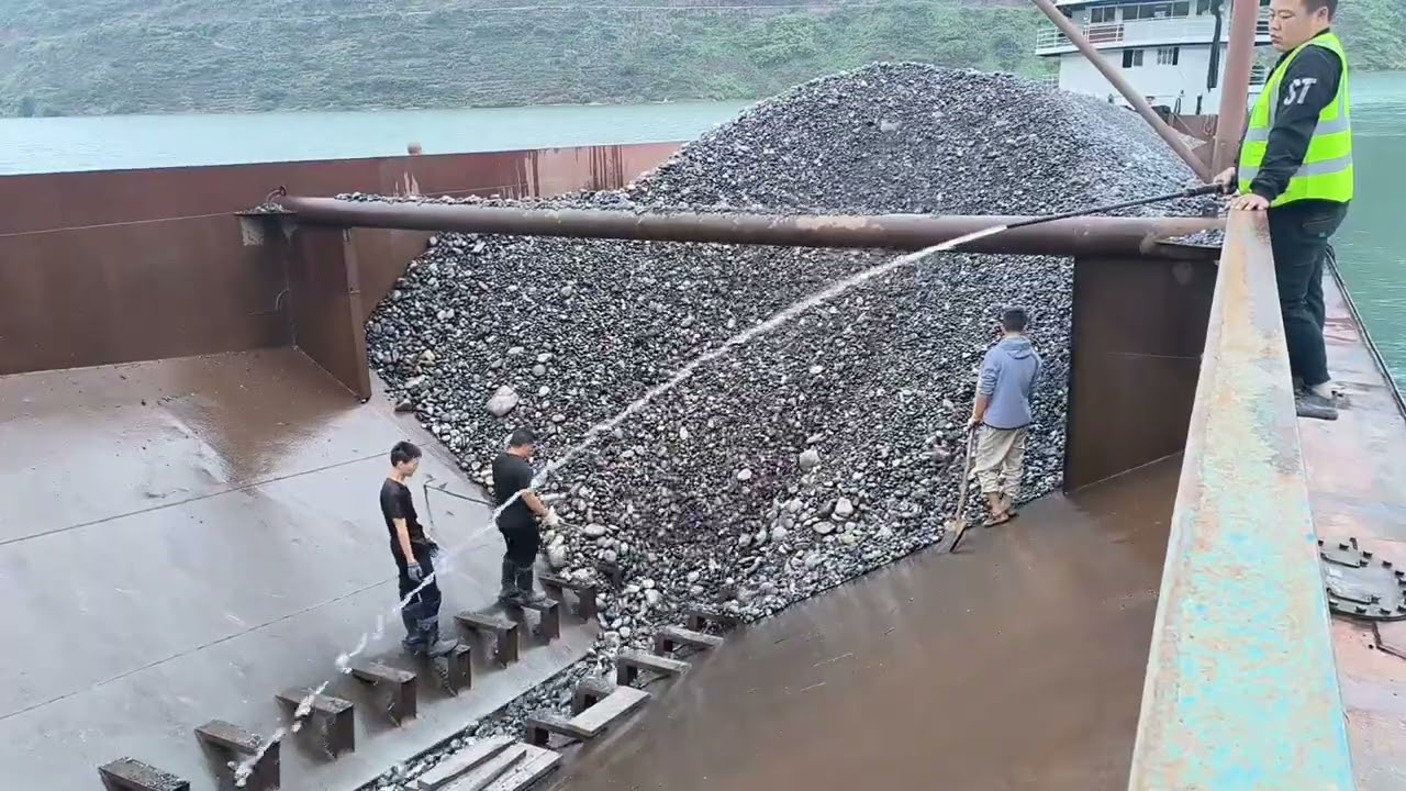 Barge unloading 3600 tons of cobblestone 4K video