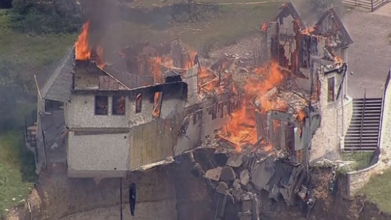 Burning down the house: Texas family burn down luxury home that hangs over 75ft cliff
