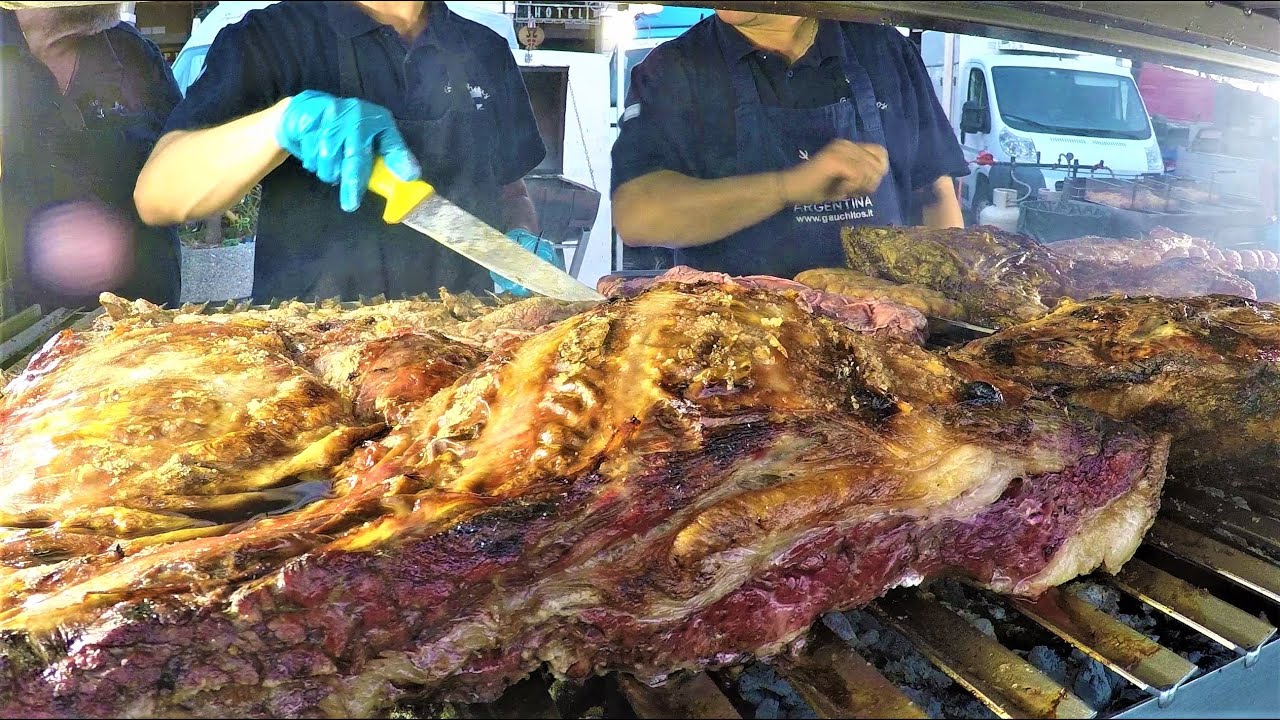 Street Food Festival in Italy. Grilled Meat, 'Porchetta', 'Lampredotto', Pork Legs, Loin, Sausages