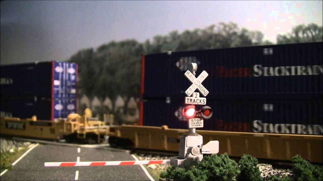 Intermodal train at crossing in HO scale