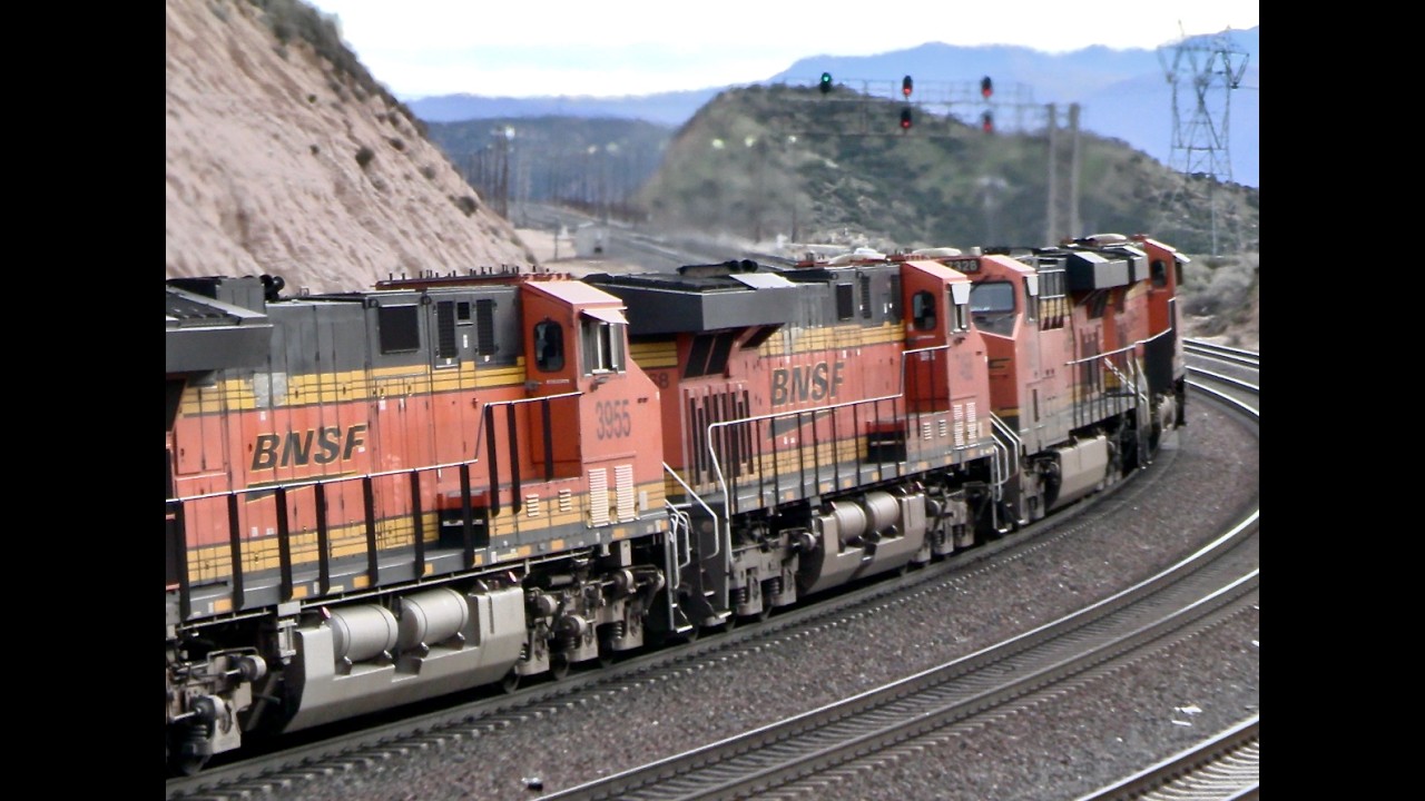 BNSF JB Hunt intermodal crests Cajon Summit on a cloudy morning