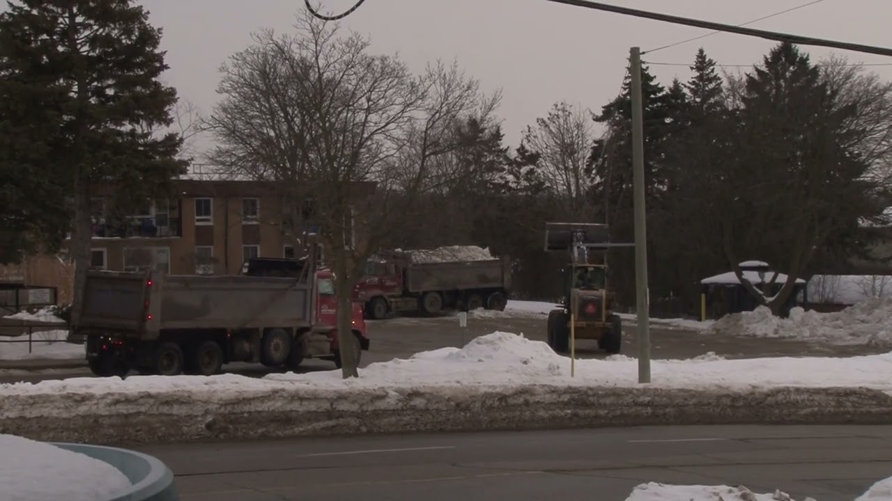 Cleaning Up And Taking Away Snow