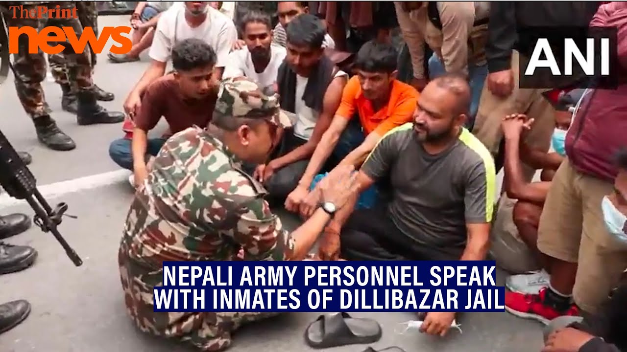 Nepali Army personnel speak with inmates of Dillibazar Jail