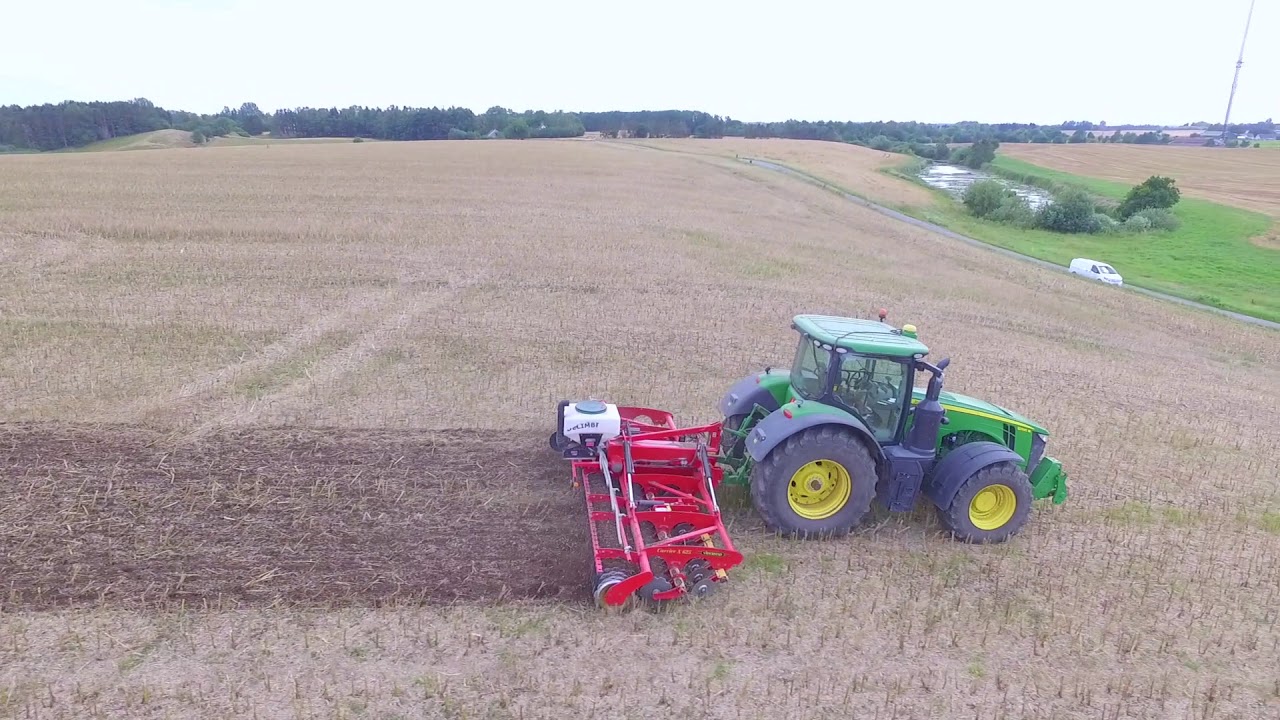 John Deere 8R performing a light stubble cultivation