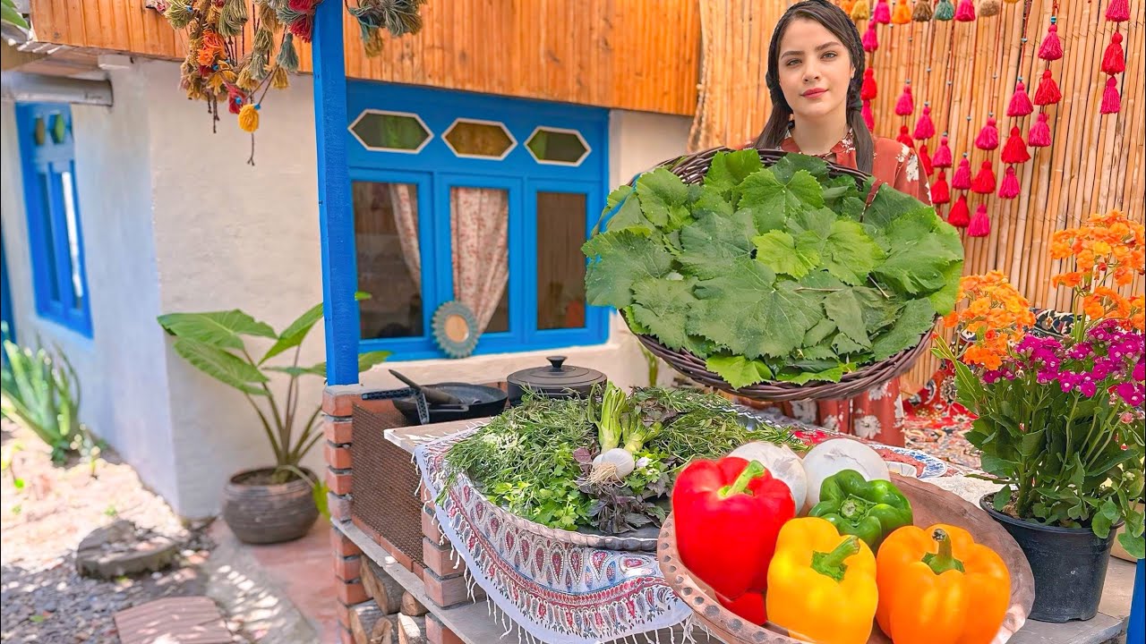 Cooking local food: Dolma with grape leaves, meat and vegetables in the village