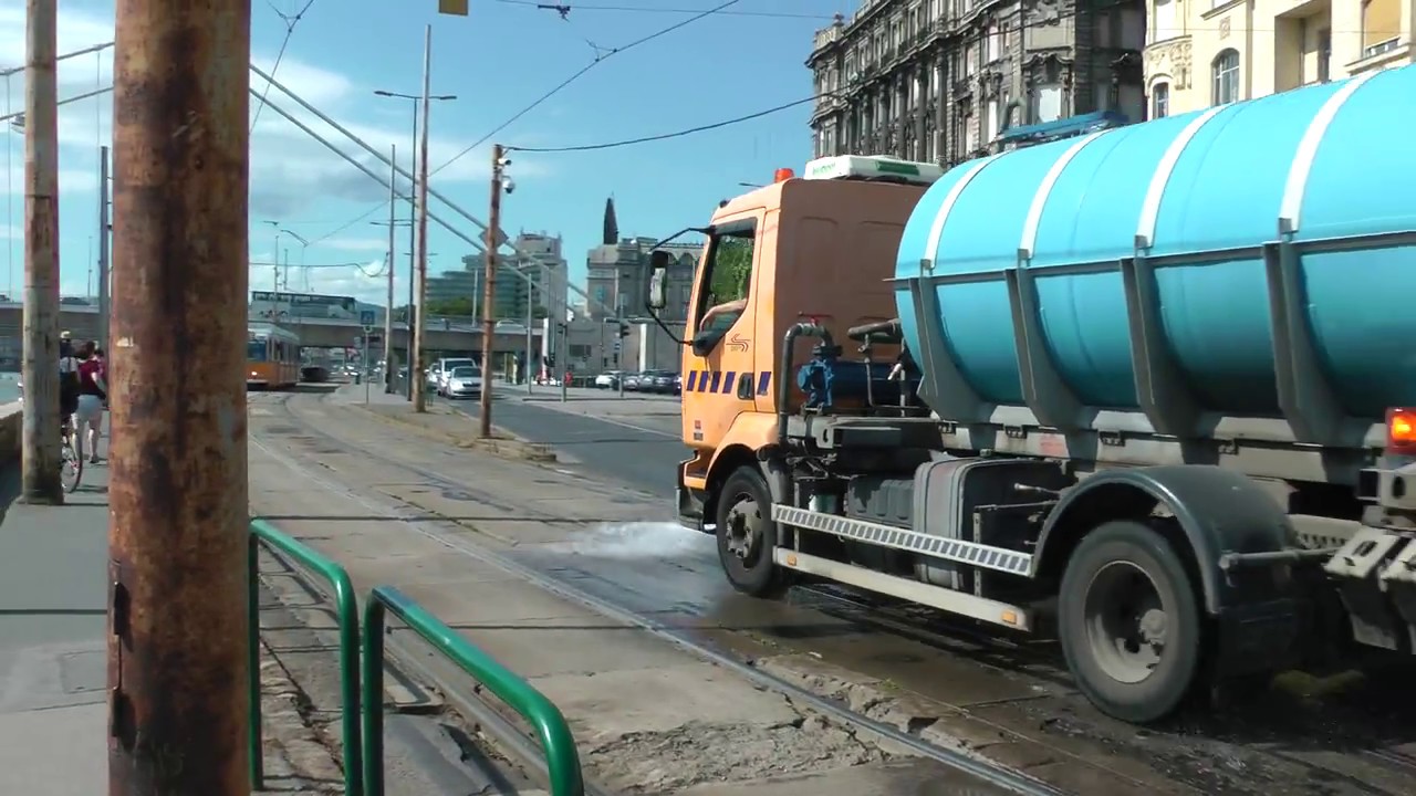 Budapest city trucks spraying water on tram tracks in Budapest, Hungary