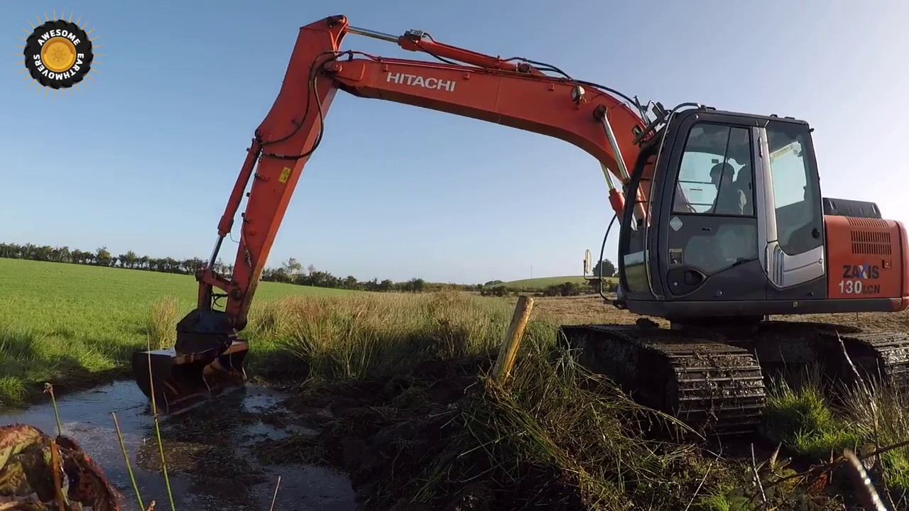 Cleaning drainage ditch with the Hitachi Zaxis 130LCN-3