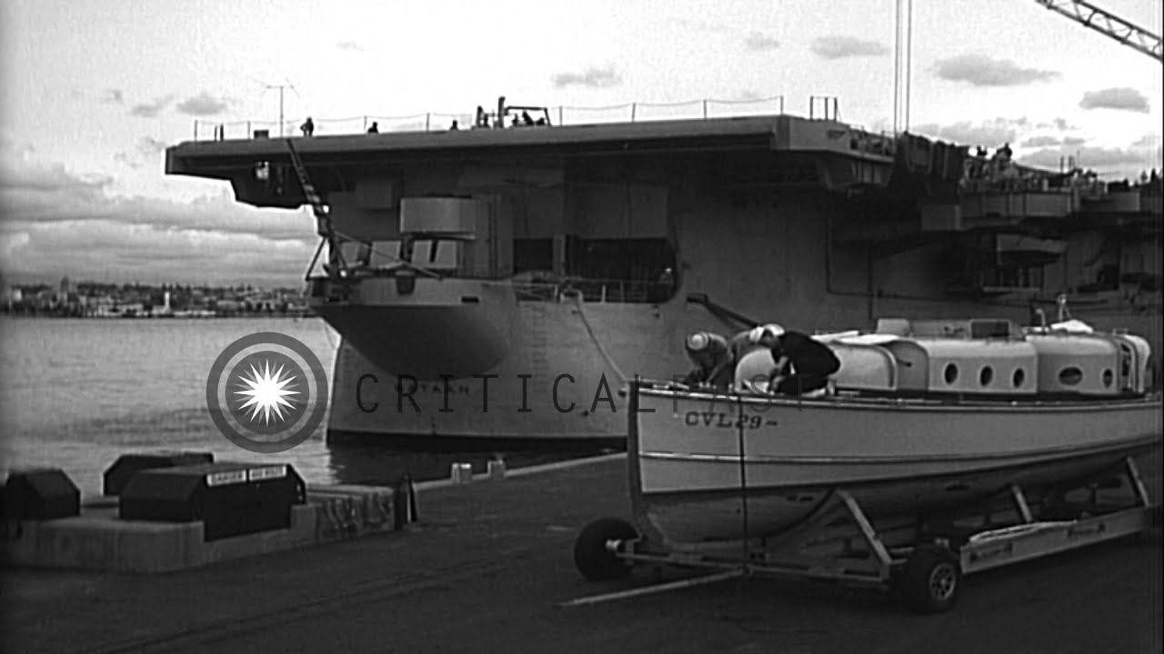 US F-84 aircraft and crates being loaded aboard United States aircraft carrier Ba...HD Stock Footage