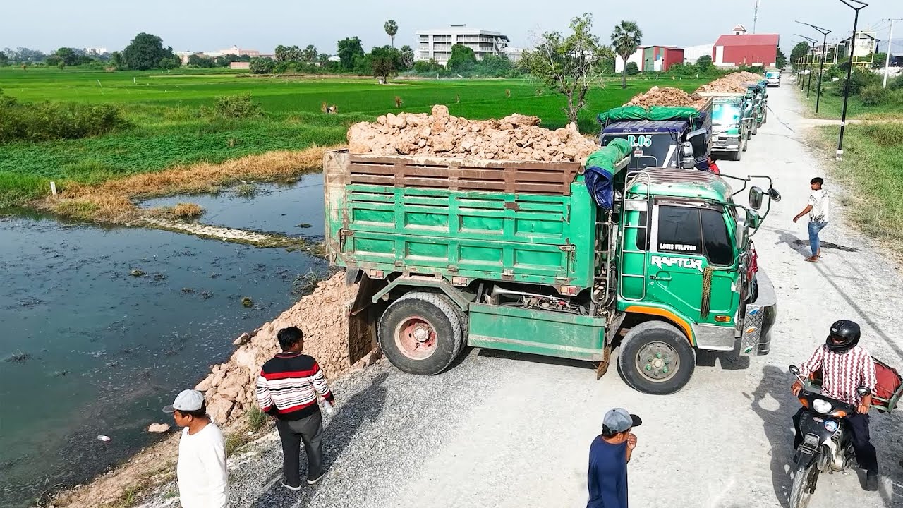 Nicely New Landfill Task! Skill Bulldozer With Dump Trucks Move On Filling Water Land Area