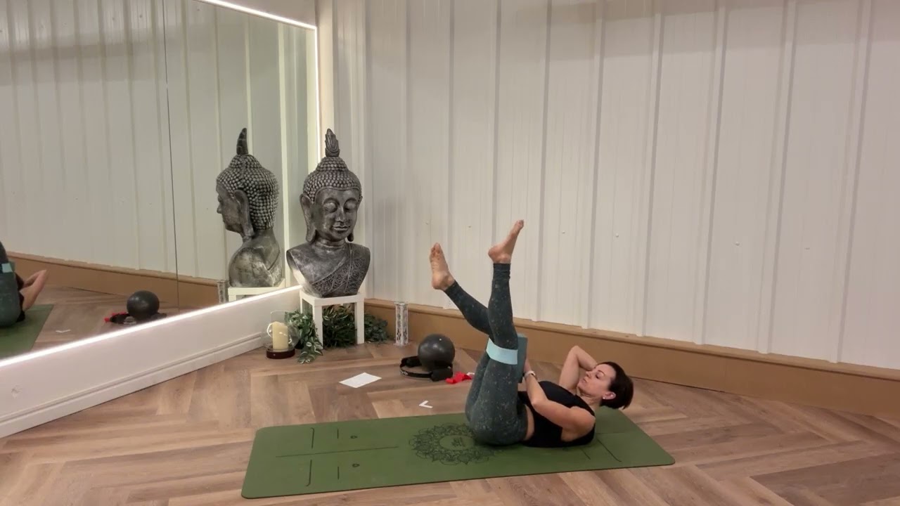 Mat Pilates class with mini band and brick