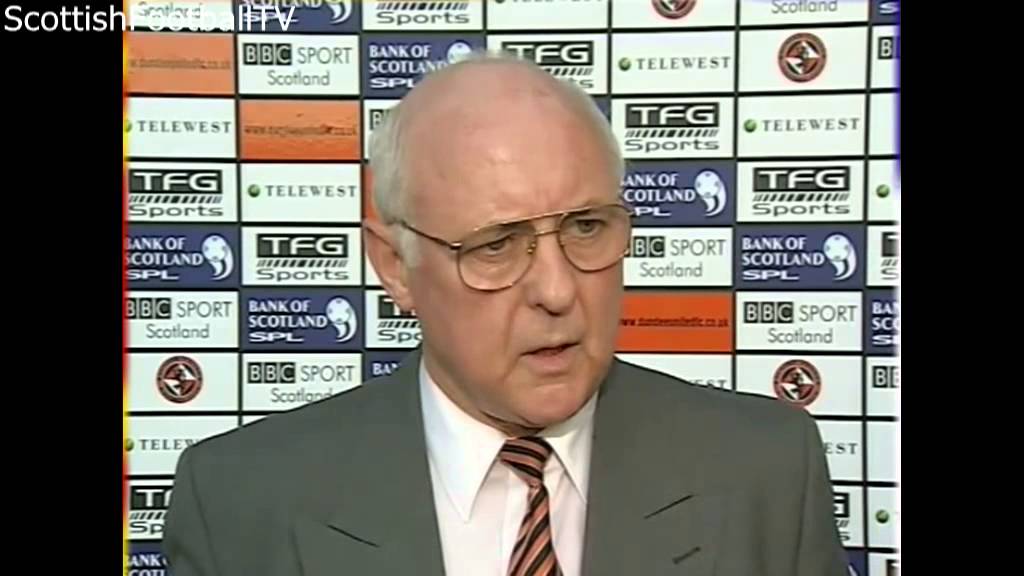 Jim McLean punches BBC reporter John Barnes