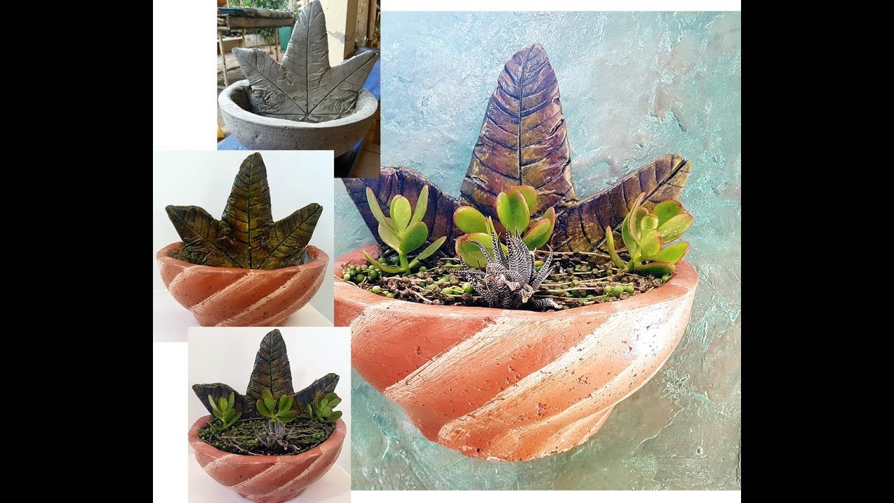 VASO  DE PAREDE FEITO DE PAPEL E CIMENTO COM DETALHE DE FOLHAS (RECICLAGEM)