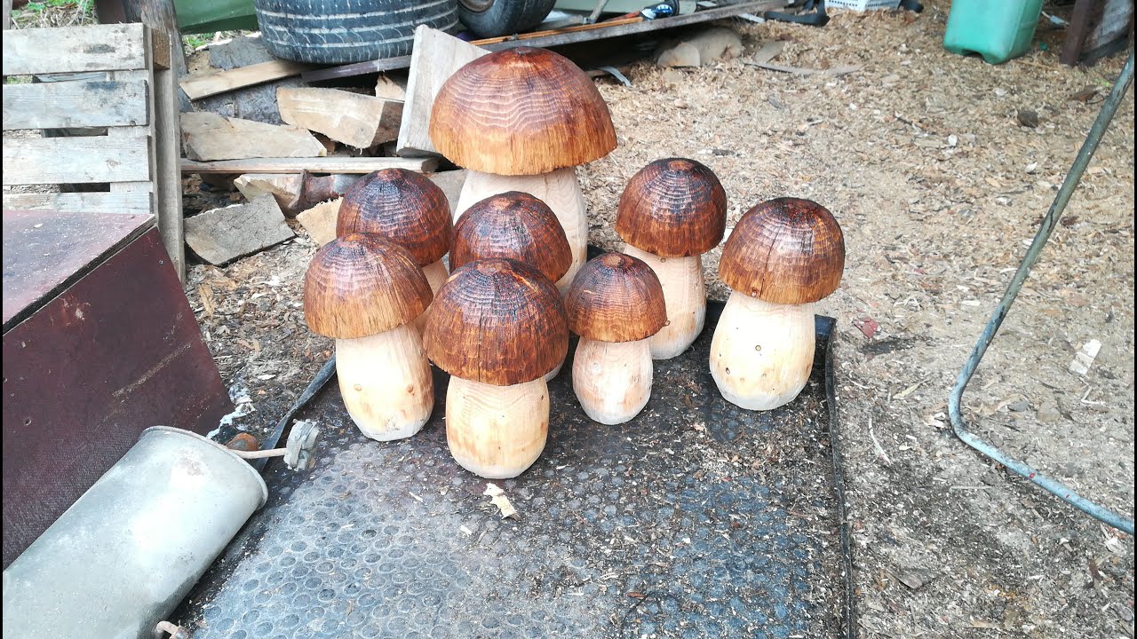 Chainsaw carving ornamental garden mushrooms.