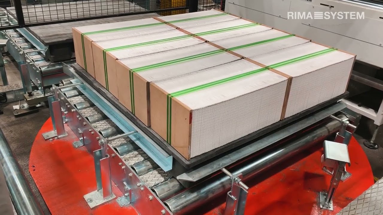 Short-run Book Printing. Log Stacking and Palletizing behind manroland Goss Sunday 4000 double-web