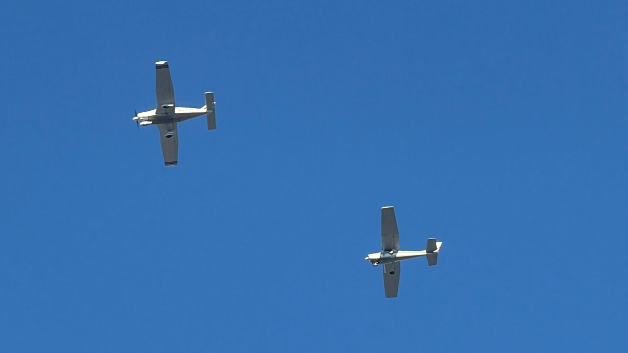 Cessna 152 (N5351P) and Piper PA-28-181 (N47771) flying in formation over my house