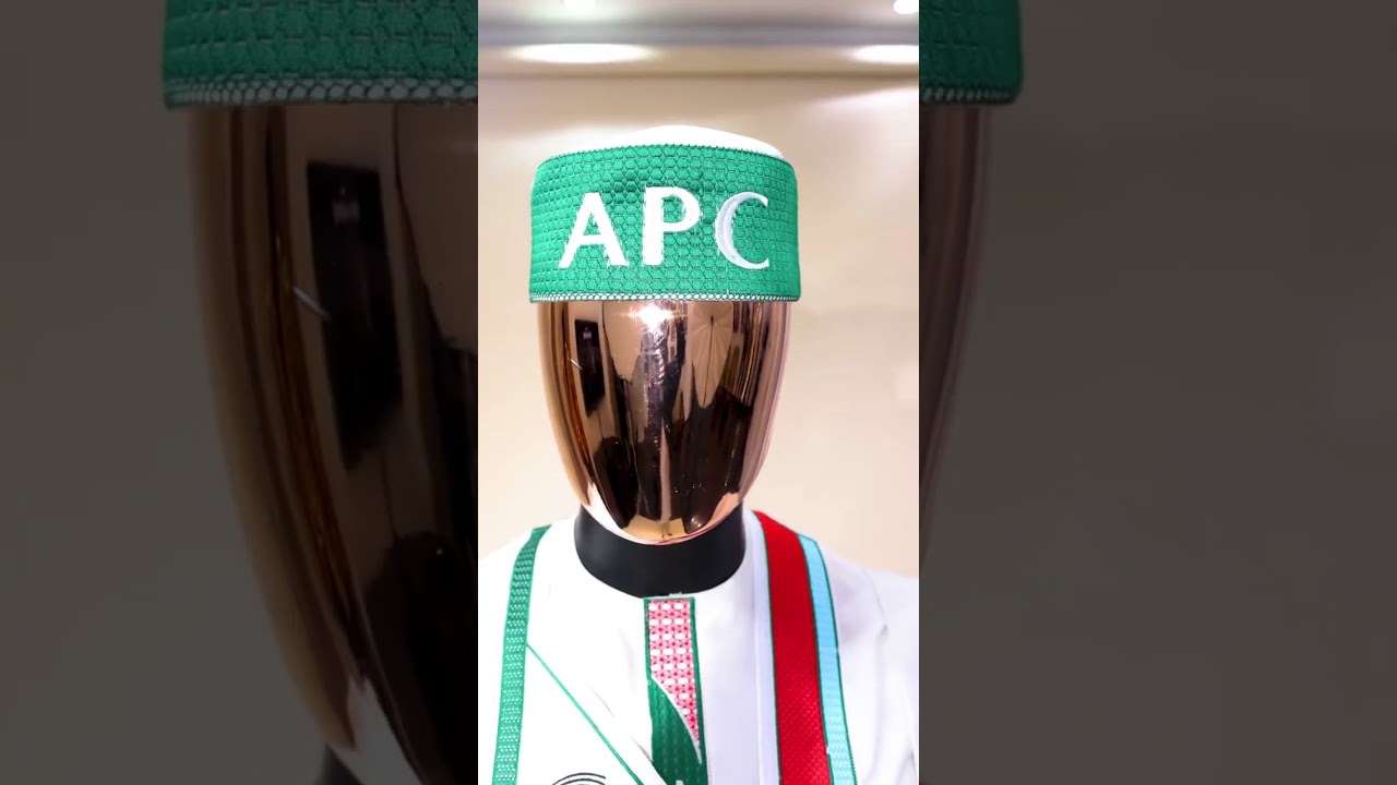 A white, APC ( All Progressive Congress) Agbada